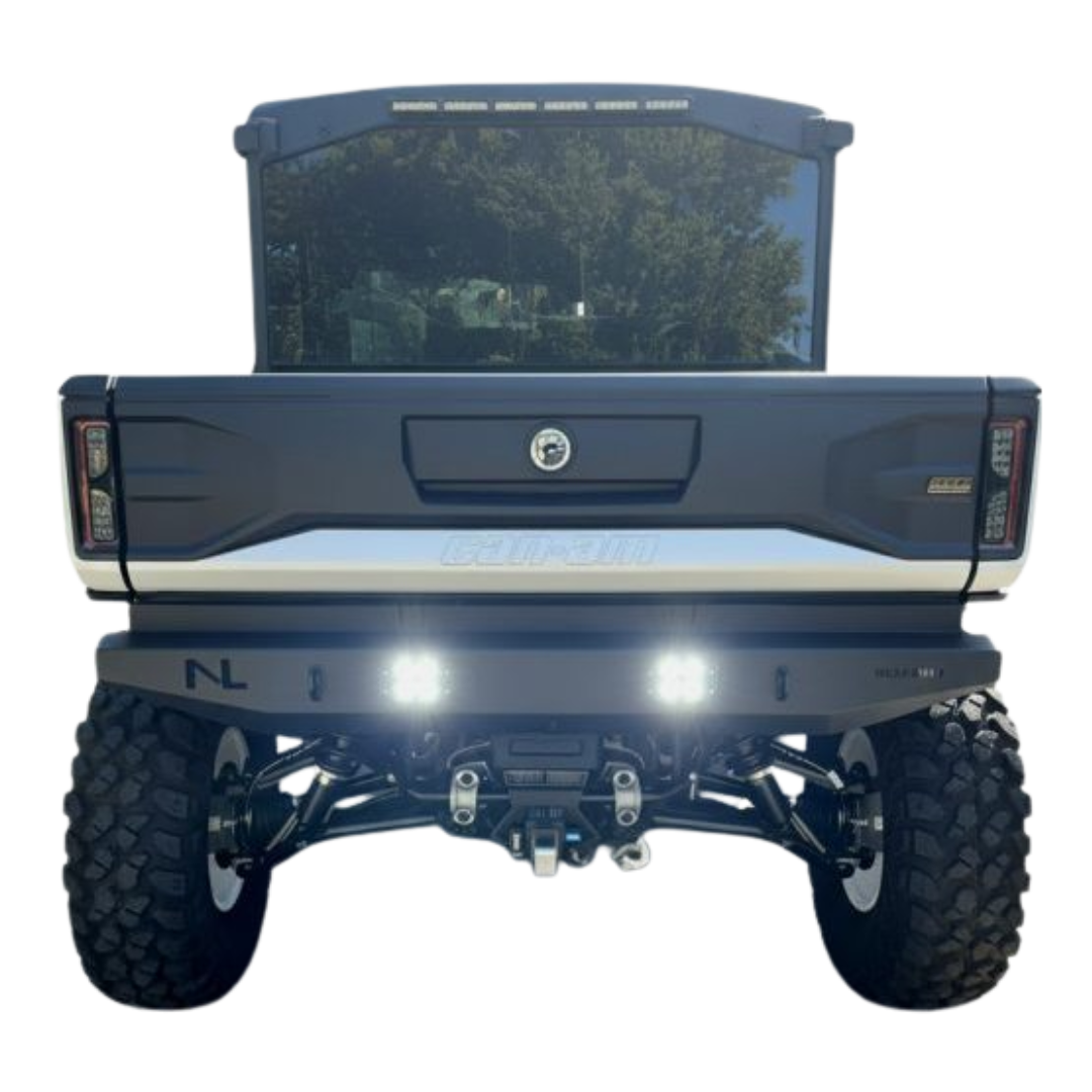 Back view of a blue truck with visible branding on a white background