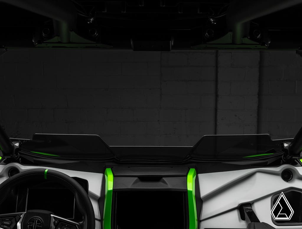 Close-up of a vehicle's interior with a focus on the dashboard and steering wheel.