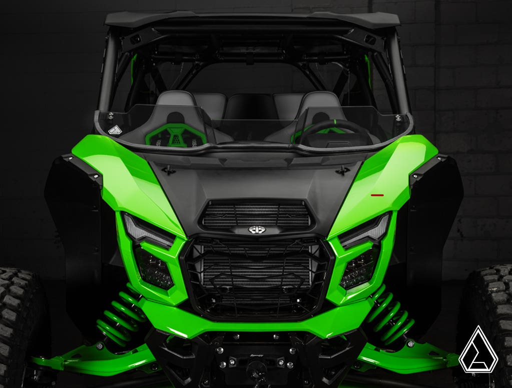 Green off-road vehicle with a black interior on a dark background